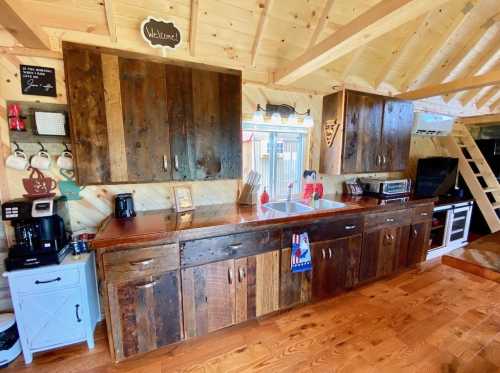 Cozy kitchen with rustic wooden cabinets, a red countertop, and a warm, inviting atmosphere.