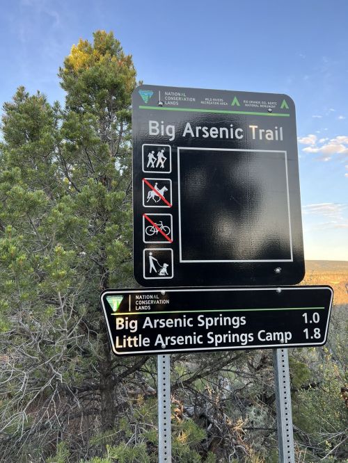 Trail sign for Big Arsenic Trail, indicating distances to Big Arsenic Springs and Little Arsenic Springs Camp.