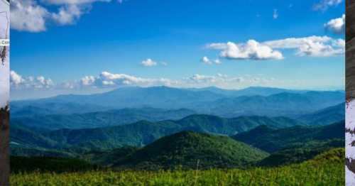 A panoramic view of lush green mountains under a bright blue sky with scattered clouds.