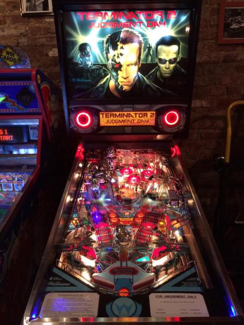 A colorful Terminator 2 pinball machine with vibrant artwork and illuminated playfield features.