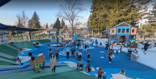 A vibrant playground scene with children playing, climbing, and exploring various structures in a sunny park setting.