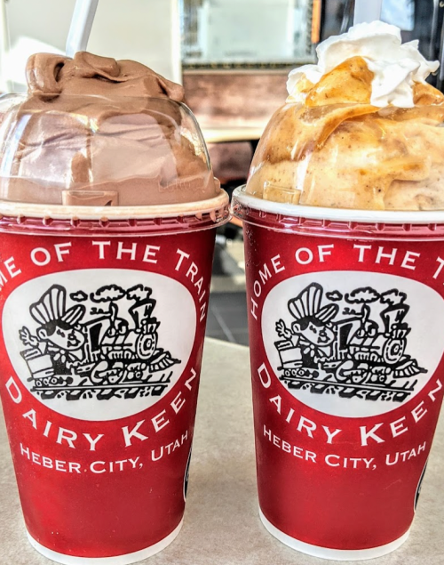 Two cups of ice cream shakes, one chocolate and one pumpkin, topped with whipped cream, from Dairy Keen in Heber City, Utah.