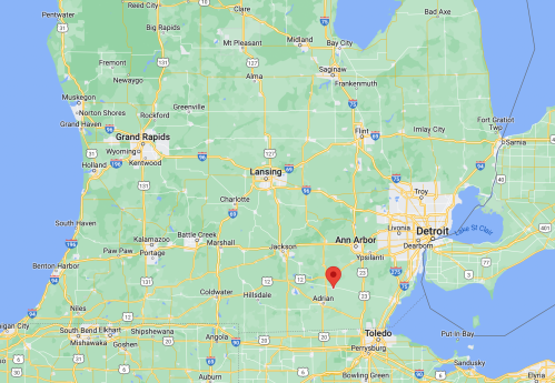Map of Michigan highlighting Adrian, located southwest of Detroit and near the Ohio border.