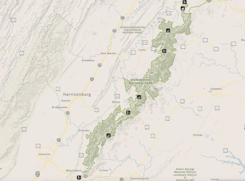 Map of Shenandoah National Park, highlighting trails, roads, and nearby towns in Virginia.