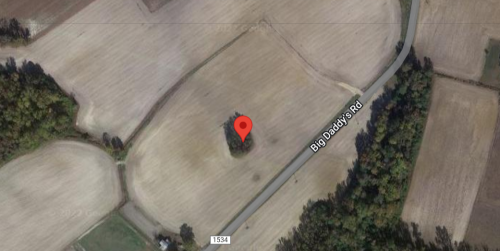 Aerial view of a rural area with fields and a road labeled "Big Daddy's Rd," marked by a red location pin.