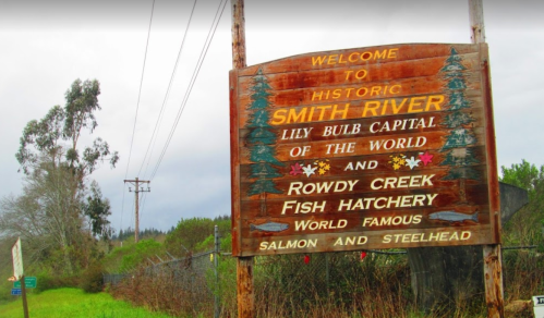Welcome sign for Smith River, highlighting its status as the Lily Bulb Capital and Rowdy Creek Fish Hatchery.