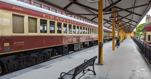 Passenger cars on the Grapevine Vintage Railroad in Texas wait for guests at the train depot.