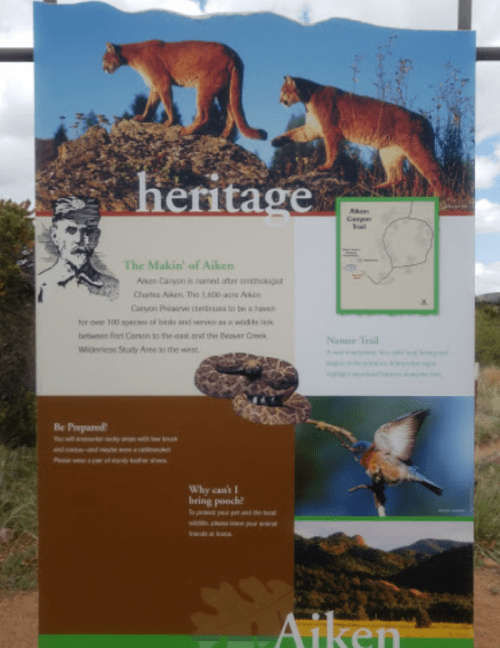 Sign about Aiken Canyon's heritage, featuring wildlife images and information about the area's natural history and trails.