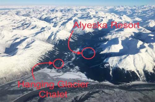 Aerial view of snow-covered mountains with labels for Alyeska Resort and Hanging Glacier Chalet.