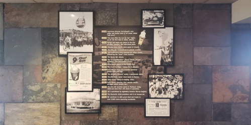 A collage of historical photos and text about a vintage ice cream shop and its milestones on a stone wall.