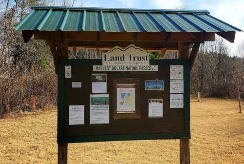 Signboard for Harvest Square Nature Preserve, featuring information about the Land Trust of Northern Alabama.