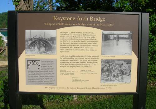 Sign about the Keystone Arch Bridge, detailing its history and significance as the longest double arch bridge west of the Mississippi.