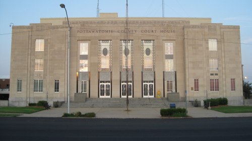 Front view of the Pottawatomie County Courthouse, featuring a grand entrance and decorative architectural details.