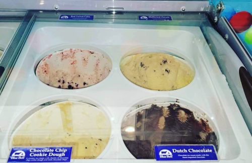 Four ice cream tubs: Red Velvet Cake, Blueberry Pecan, Chocolate Chip Cookie Dough, and Dutch Chocolate.