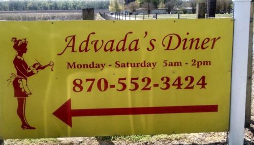 Sign for Advada's Diner with hours (Mon-Sat, 5am-2pm) and phone number, featuring a graphic of a waitress.
