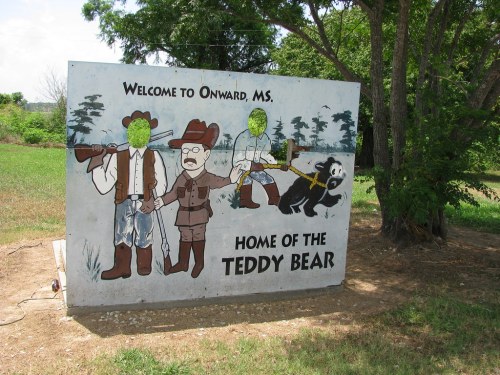A mural welcoming visitors to Onward, MS, featuring cartoon characters and a bear, with "Home of the Teddy Bear" text.