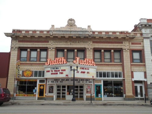 Historic theater building with "Judith" marquee, featuring a coffee shop and bakery on the ground floor.