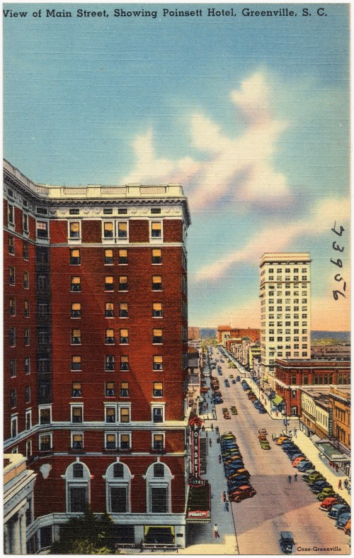 A vintage postcard view of Main Street in Greenville, SC, featuring the Poinsett Hotel and bustling street activity.