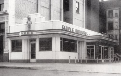 Historic black-and-white photo of a Kewpee Hamburgers restaurant, featuring a distinctive Art Deco facade.
