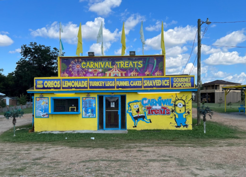 A colorful food stand named "Carnival Treats" offers various snacks like funnel cakes and gourmet popcorn.