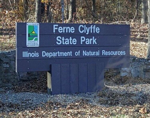 Sign for Ferne Clyffe State Park, Illinois, displaying the park's name and the Department of Natural Resources logo.