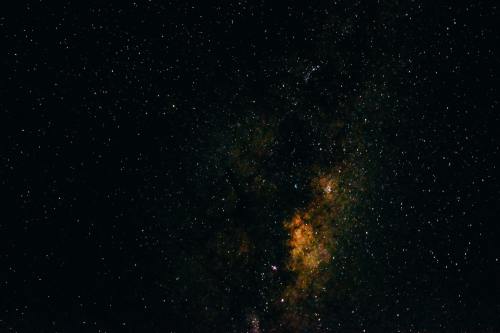 A stunning view of a starry night sky filled with countless stars and colorful cosmic clouds.