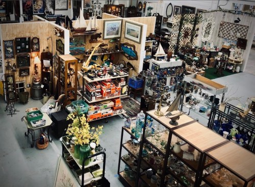 Aerial view of a bustling antique shop filled with various vintage items, decor, and collectibles on display.