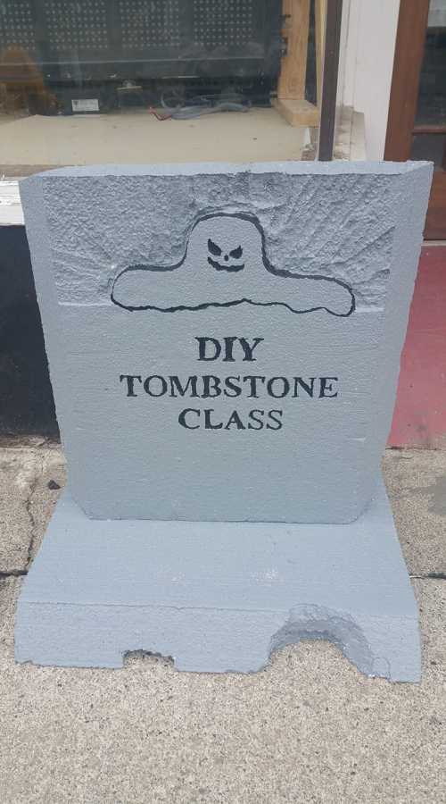 A gray tombstone sign reading "DIY Tombstone Class" with a ghost graphic above the text.