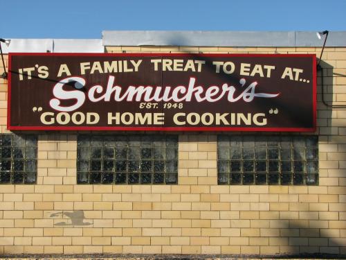 Sign for Schmucker's Good Home Cooking, established in 1948, promoting it as a family treat to eat at.