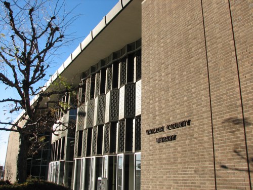 Exterior view of the Vancouver County Library building, featuring a modern design and large windows.
