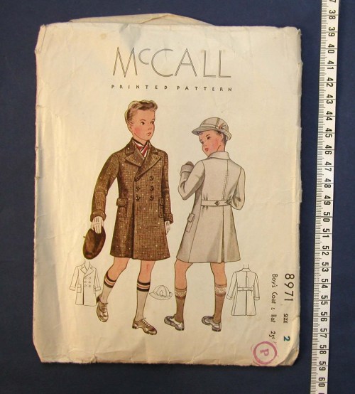 Vintage McCall printed pattern for boys' coats, featuring two designs on the cover with illustrations and measurements.