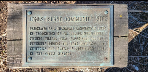 Bronze plaque detailing the history of Jones Island Community Site as a Milwaukee landmark and fishing village.
