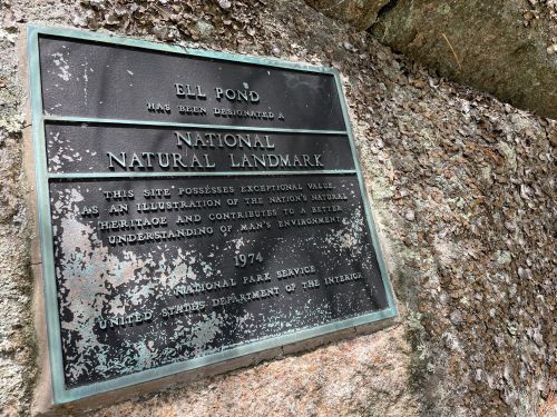 Plaque designating Ell Pond as a National Natural Landmark, highlighting its exceptional natural value. 1974.