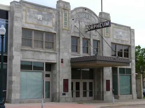 Art Deco-style building with "Orpheum" sign, featuring large windows and a decorative facade.