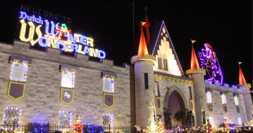 A brightly lit castle with festive decorations, featuring "Welcome to Dutch Winter Wonderland" in colorful lights.