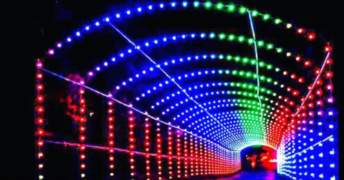A colorful tunnel illuminated with red, green, and blue lights, creating a vibrant, glowing effect.