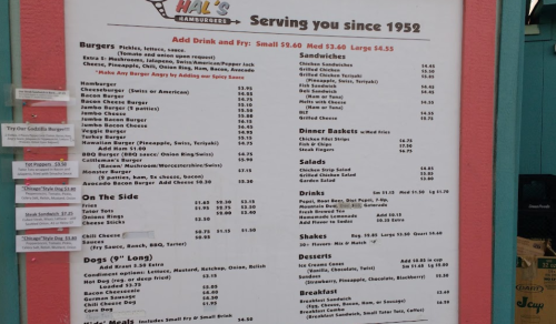 Menu board from Hal's Hamburgers featuring burgers, sandwiches, sides, and desserts with prices listed. Established 1952.