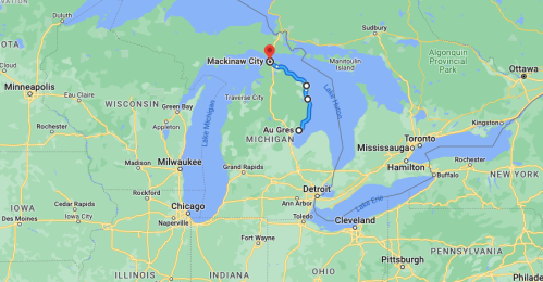 Map showing a route from Mackinaw City, Michigan, to Au Gres, with surrounding states and bodies of water.