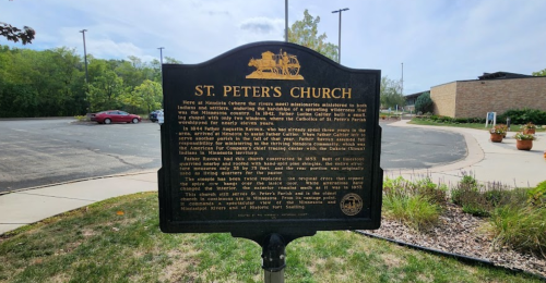 Historical marker for St. Peter's Church, detailing its significance and history in the area.