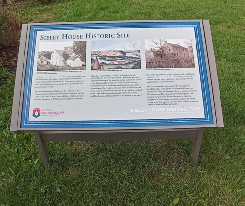Sign for Sibley House Historic Site, featuring historical information and images about the site and its significance.