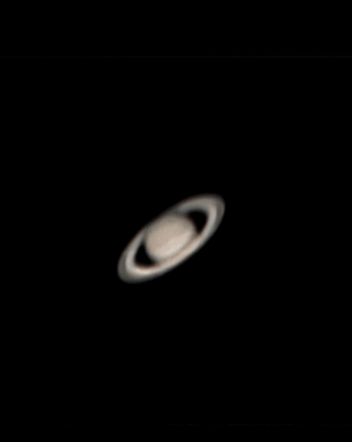 A close-up view of Saturn, showcasing its rings against a dark background.