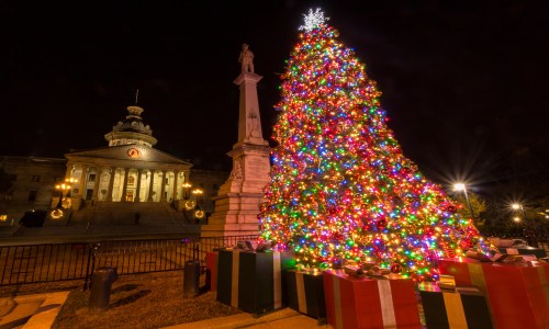 South Carolina State House decorated with Christmas lights and holiday decorations.