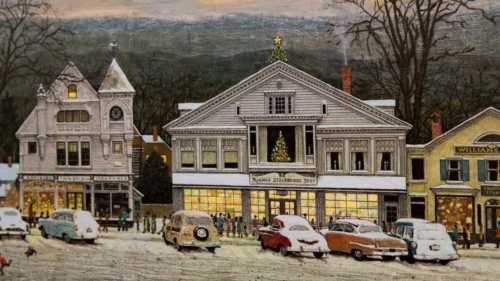 A snowy street scene with vintage cars and festive buildings, decorated for the holidays, in a quaint town setting.