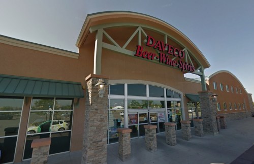 Exterior of Daveco Beer-Wine-Spirits store, featuring a stone facade and large glass entrance.