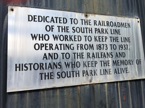 Plaque honoring the railroad workers of the South Park Line, operational from 1873 to 1937, and their legacy.