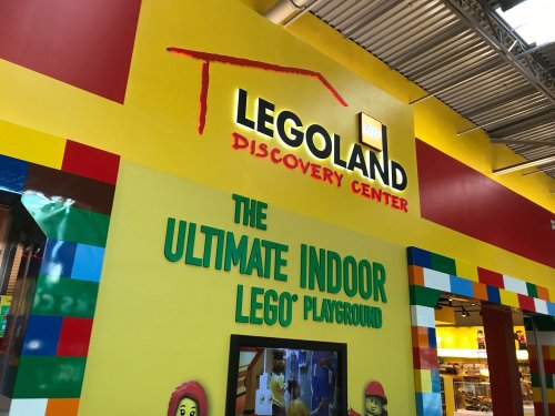 Colorful entrance to LEGOLAND Discovery Center, featuring bright signage and playful LEGO-themed decor.