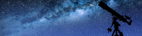 A silhouette of a telescope against a starry night sky filled with the Milky Way.