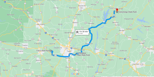 Map showing a route from Trace State Park to Tishomingo State Park, indicating a travel time of 1 hour and 28 minutes.