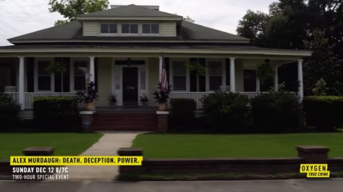 A large, two-story house with a porch and lawn, promoting an upcoming special event on Oxygen.
