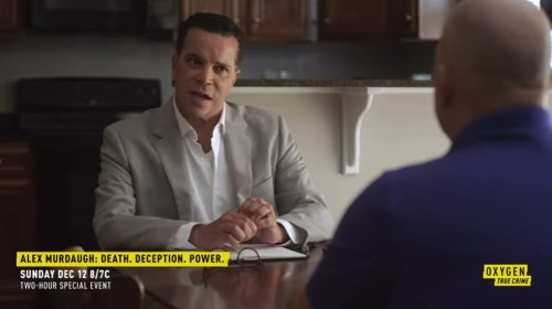 A man in a suit sits at a table, speaking intently to another person off-screen. Text promotes a special event on Oxygen.